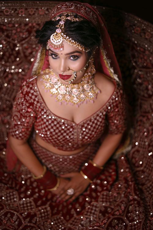 Free Stunning portrait of a South Asian bride in intricate traditional clothing and jewelry. Stock Photo