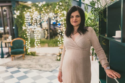 Pregnant Woman in Brown Dress