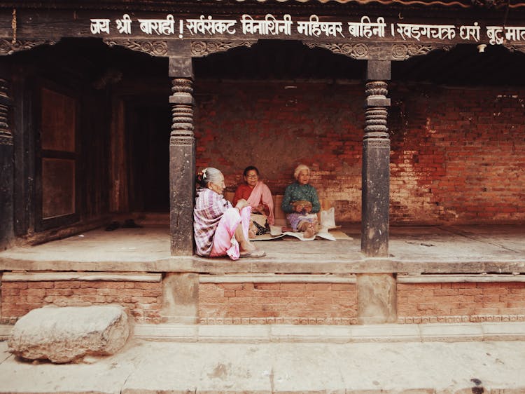 Woman Sitting On The Ground 