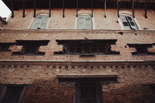 Brown Brick Building With Wooden Windows