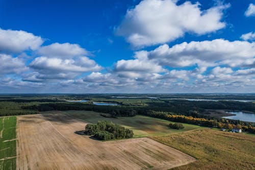Aerial Photography of Agricultural Lands Under Cloudy Sky