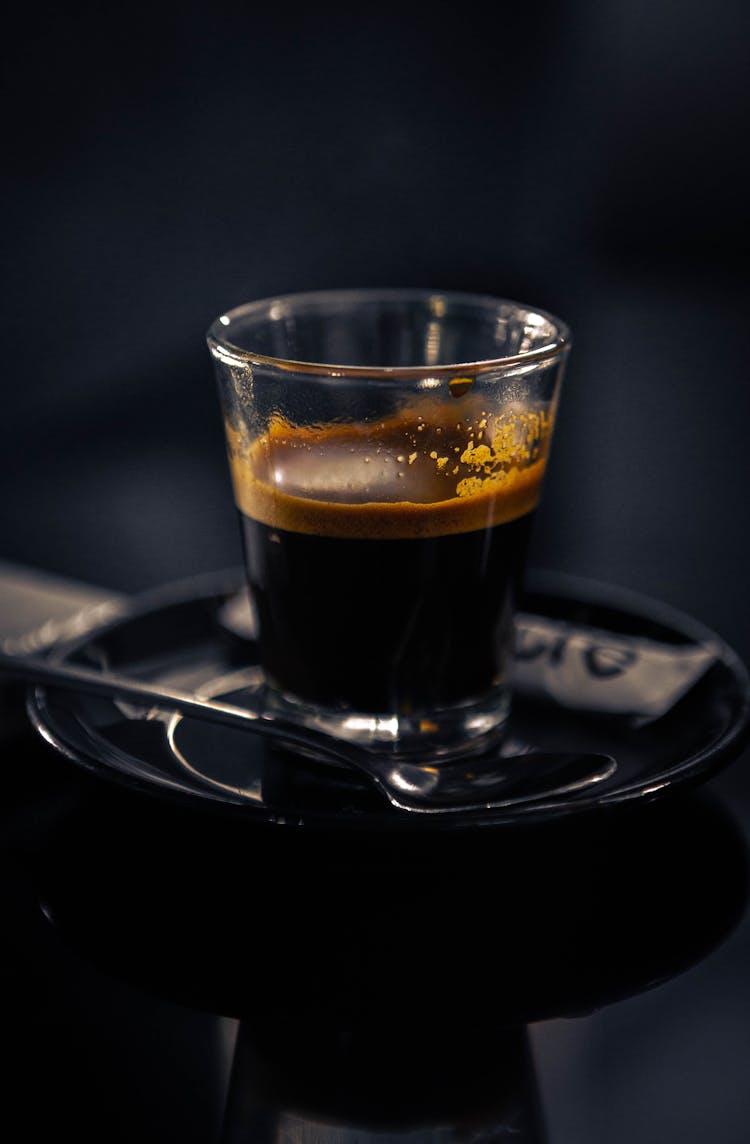 A Black Coffee On A Clear Drinking Glass