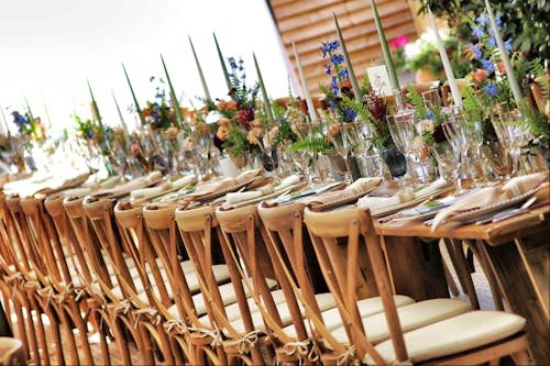 White-padded Brown Wooden Chairs Near Brown Table Outdoor