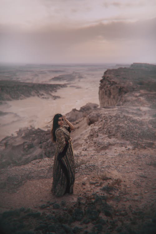 Woman in Dress on Hilltop over River