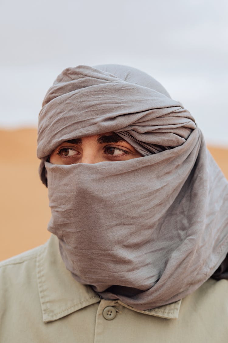 A Man Wearing A Desert Scarf