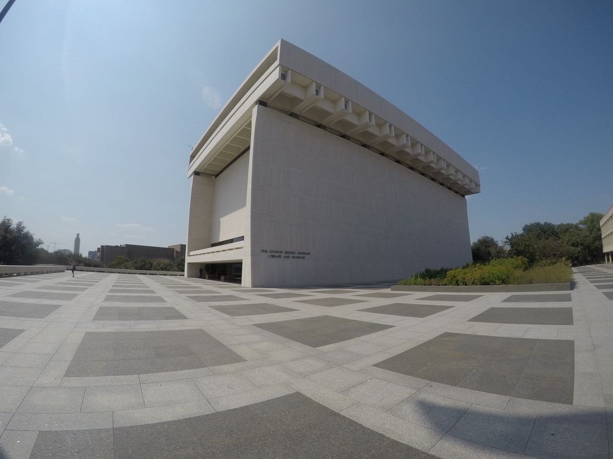 Monumental sculptural concrete cultural building on a stone plaza