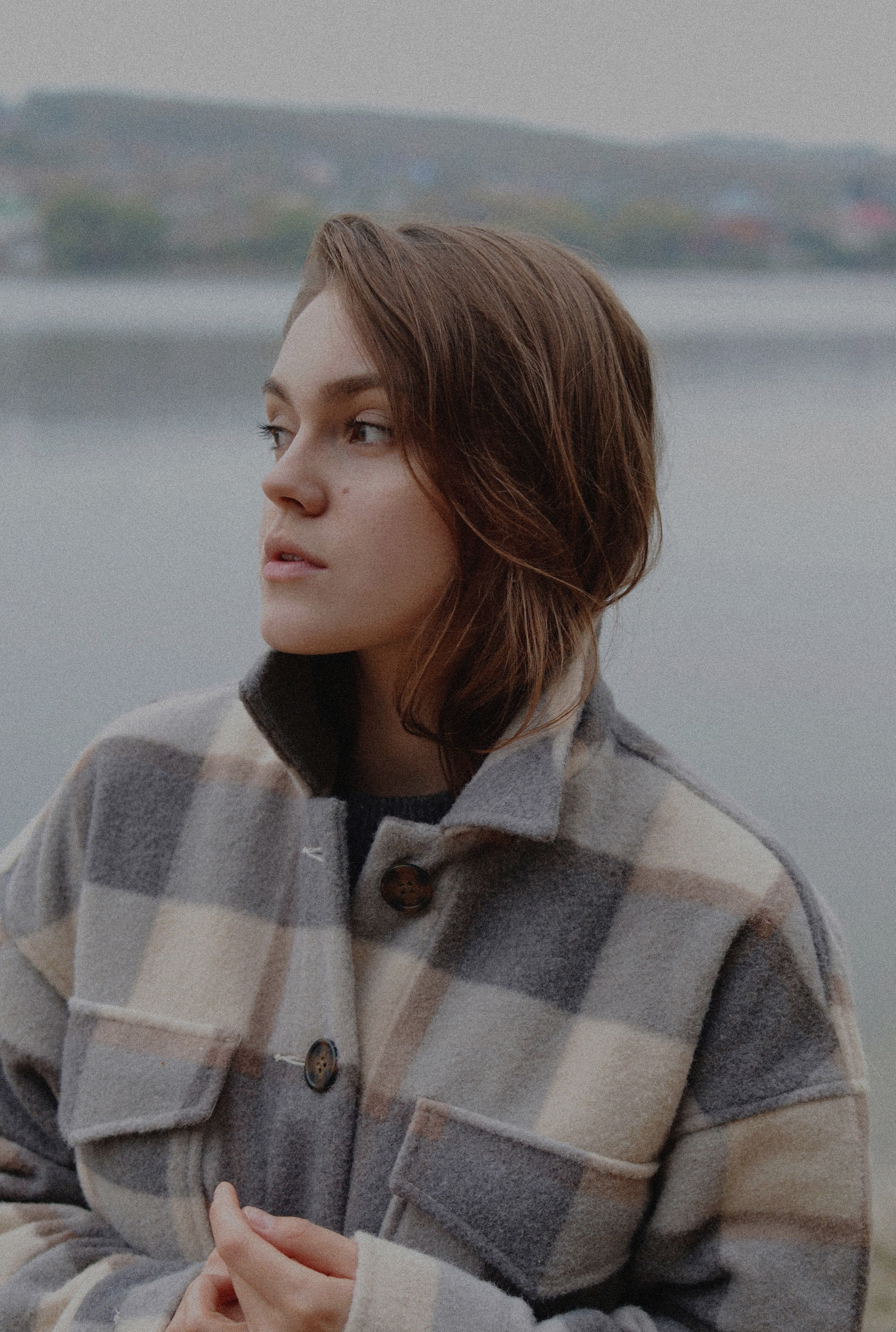 Close-Up Shot of a Woman in Checkered Coat · Free Stock Photo