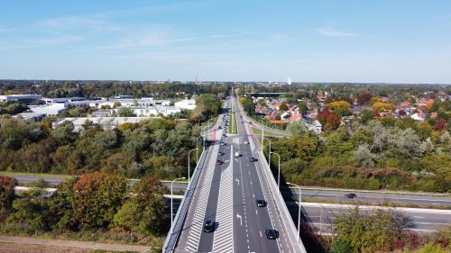 Free Drone shot capturing a vibrant road and surrounding landscape in Turnhout, Belgium. Stock Photo