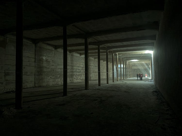 People Inside A Building Under Construction