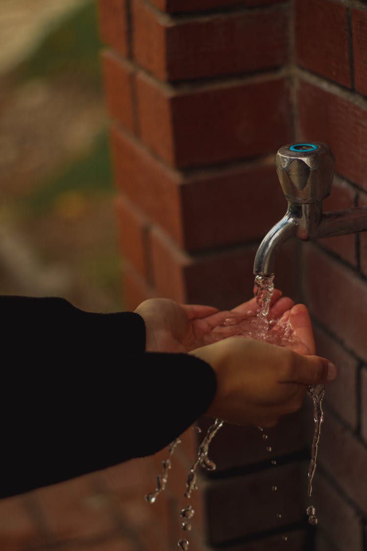 A Person Washing Their Hands