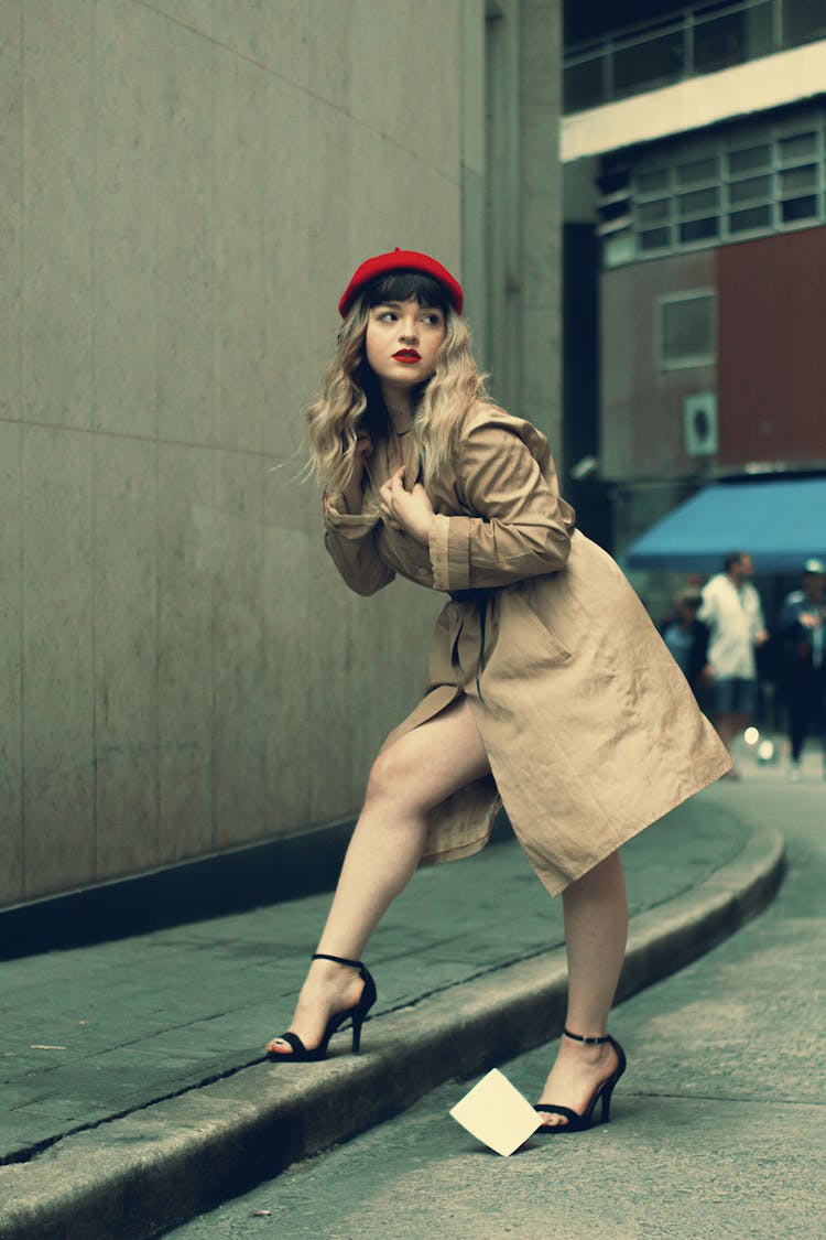 Woman In Brown Coat And Red Beret Hat 