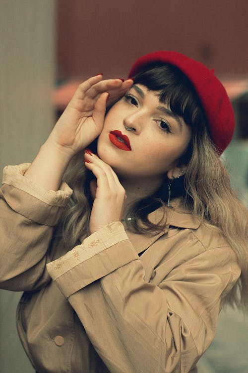 Young Woman in a Trench Coat and Red Beret 