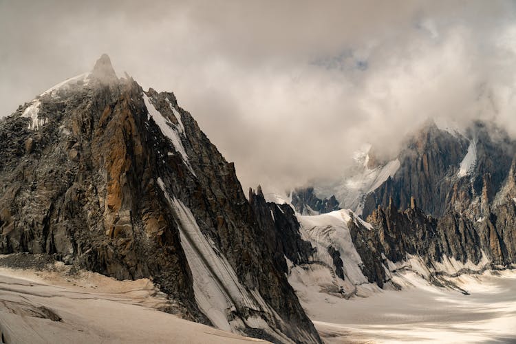 Landscape Of Rocky Mountains In Snow 