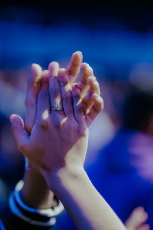 A Person Wearing Diamond Ring Clapping Hands