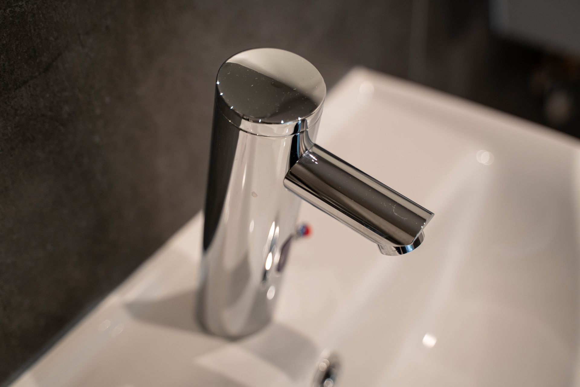 Stainless Steel Faucet on White Ceramic Sink