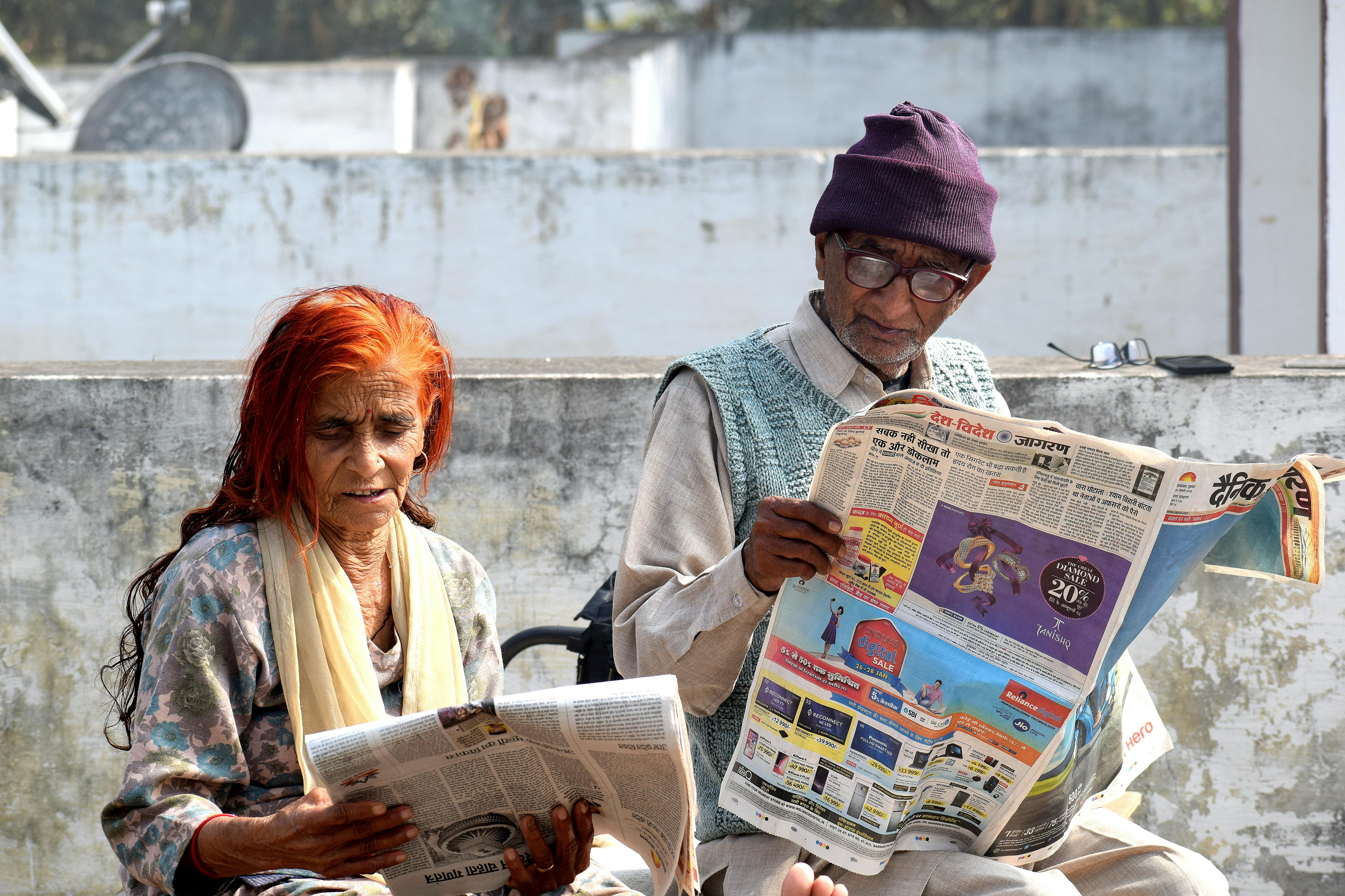 Free stock photo of #old #man #woman #newspaper #reading #persons