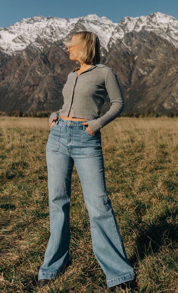 Woman in wide-leg jeans with cropped cardigan