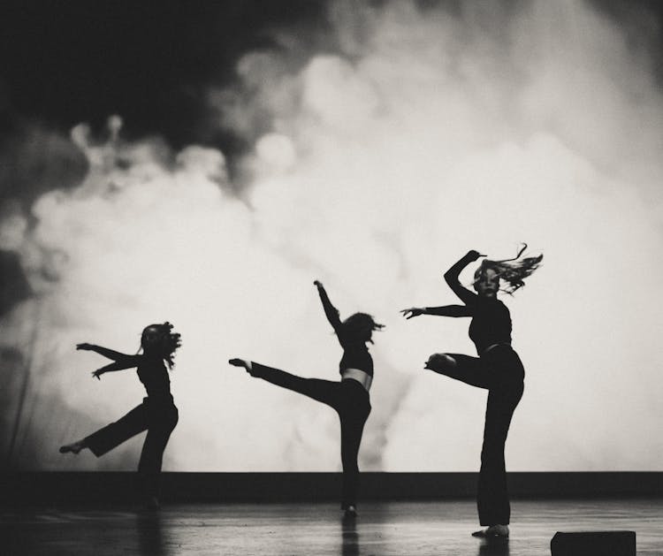 Woman And Girls Dancing On Stage In Black And White