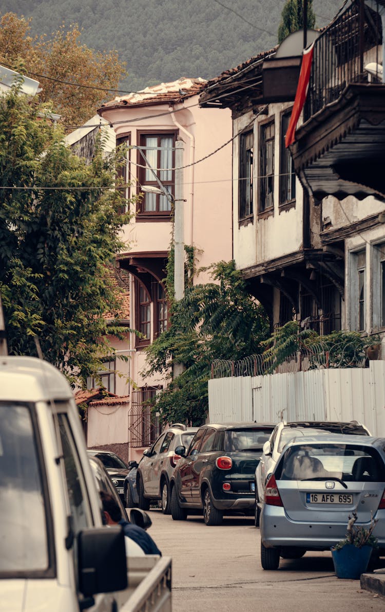 Cars Parked In Front Of Houses