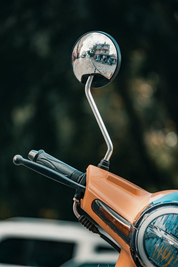 Side Mirror Of Orange Scooter 