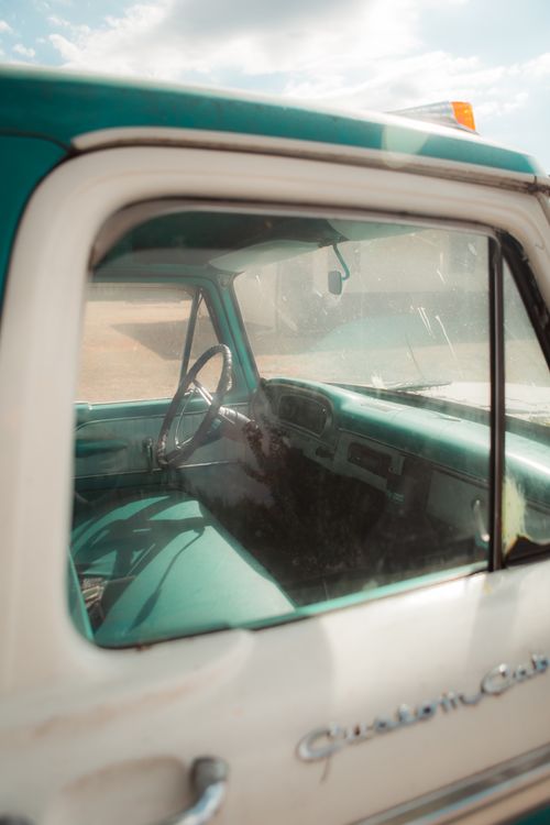 Free Explore a nostalgic view of a vintage car interior with 'Custom Cab' details. Stock Photo