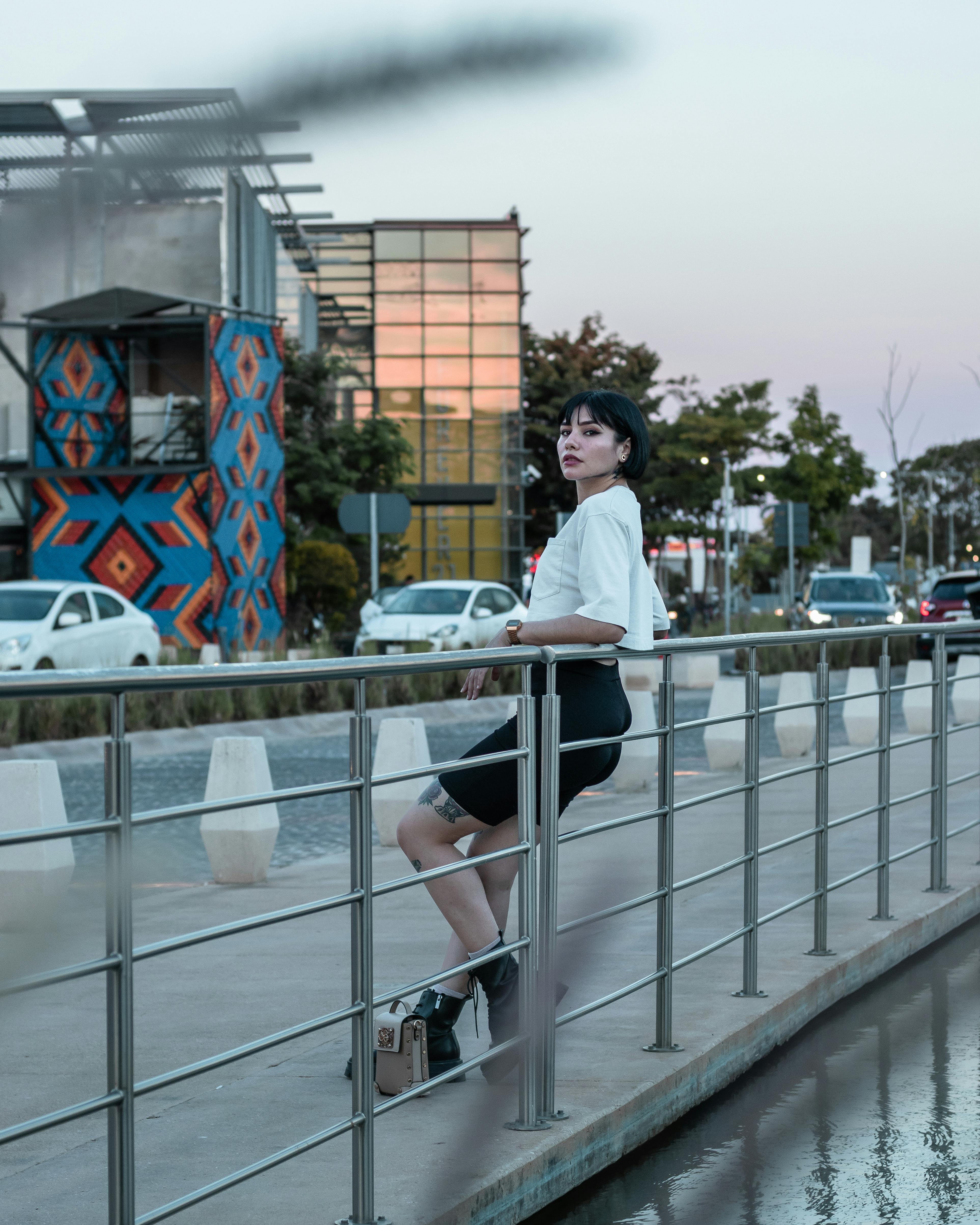 Man and Woman Standing Near Black Metal Railings · Free Stock Photo