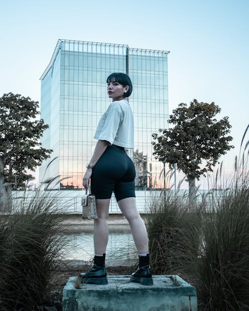 Woman in Crop Top and Cycling Shorts Looking Back