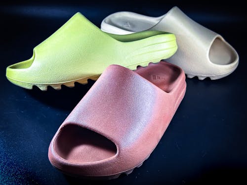 Yeezy Slides on Blue Surface 