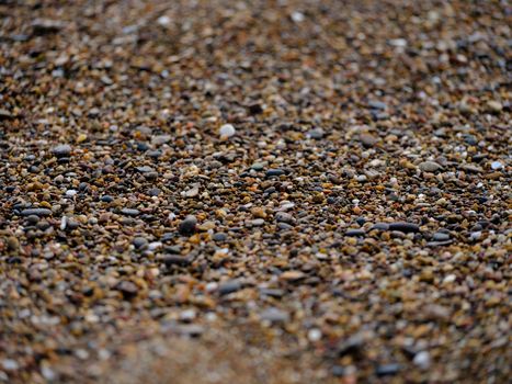 Intricate close-up view of a pebble-covered surface with diverse textures.