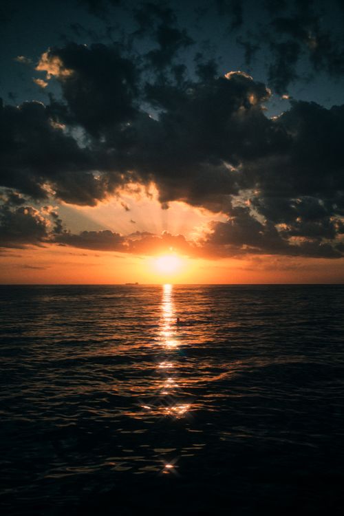 Free Stunning sunset over the Mediterranean Sea, showcasing vibrant colors and calm waters in Antalya, Turkey. Stock Photo