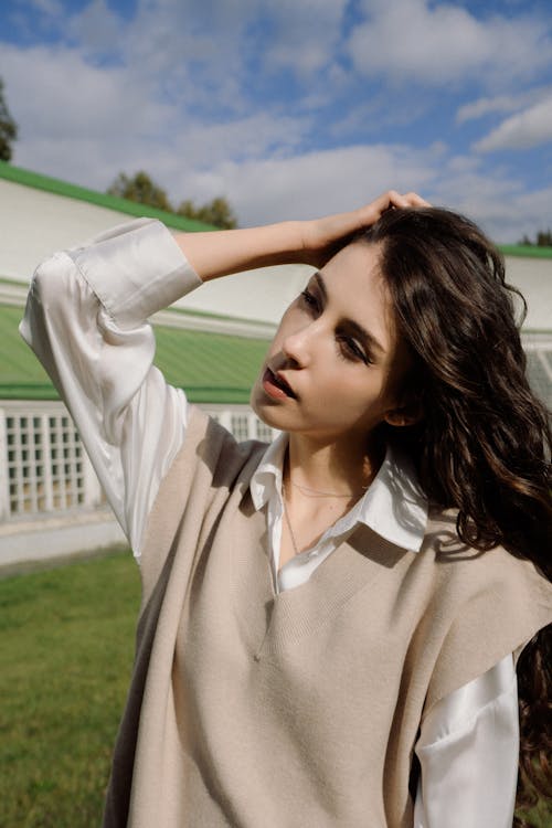 Brunette Woman Fixing Hair