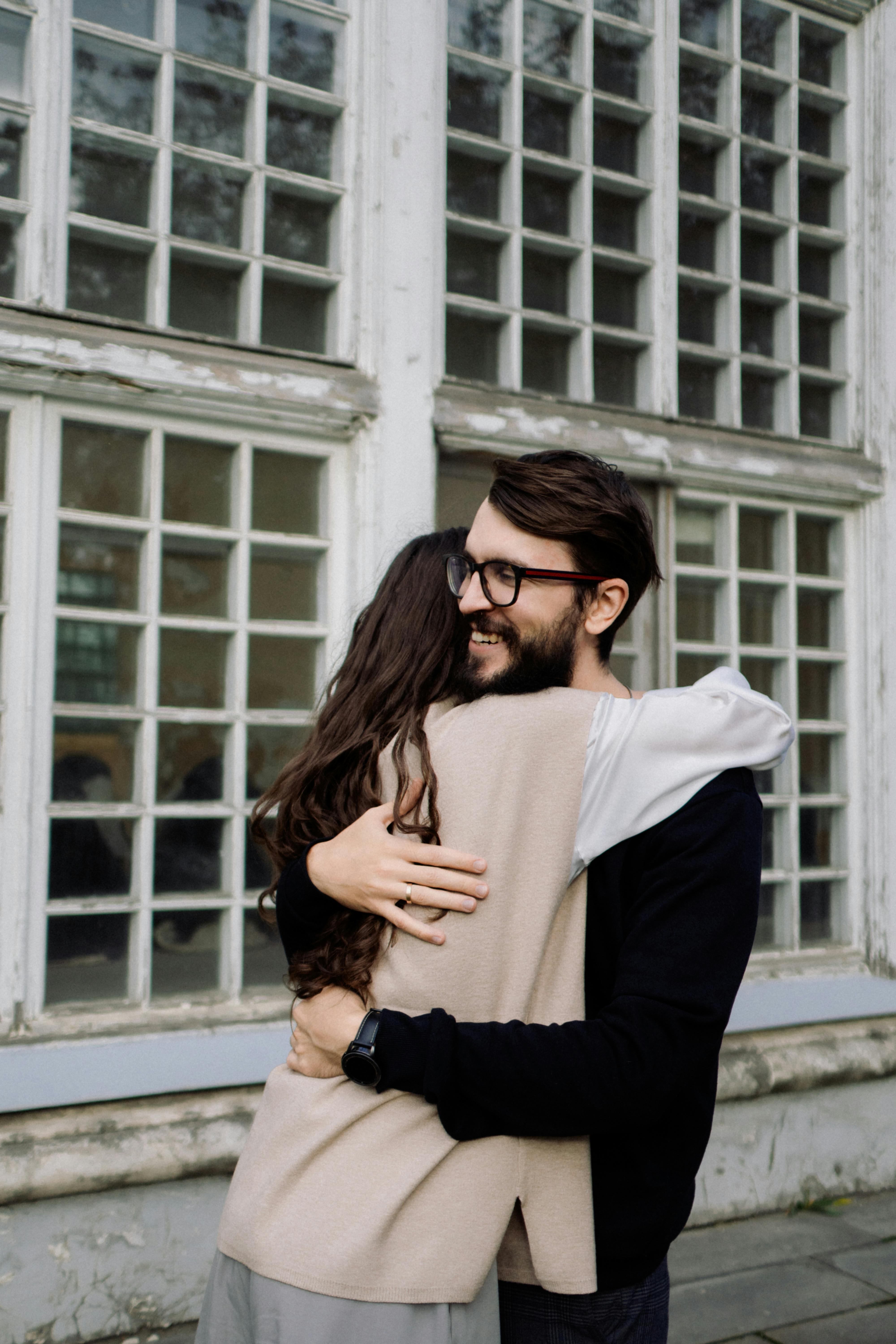 Smiling Man Hugging Woman · Free Stock Photo