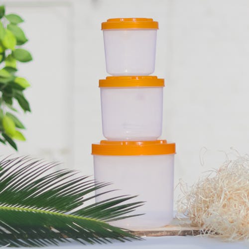 Close-up of Plastic Containers with Orange Lid