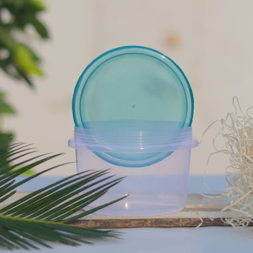 A Blue Lid Inside the Plastic Container