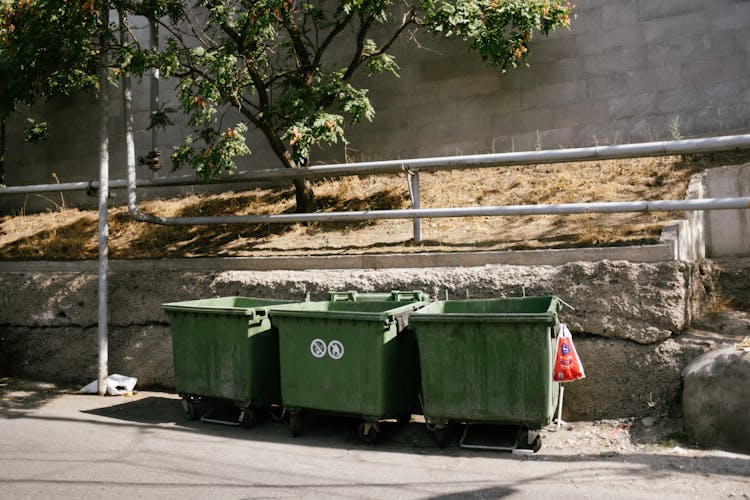 Green Garbage Bin On The Roadside