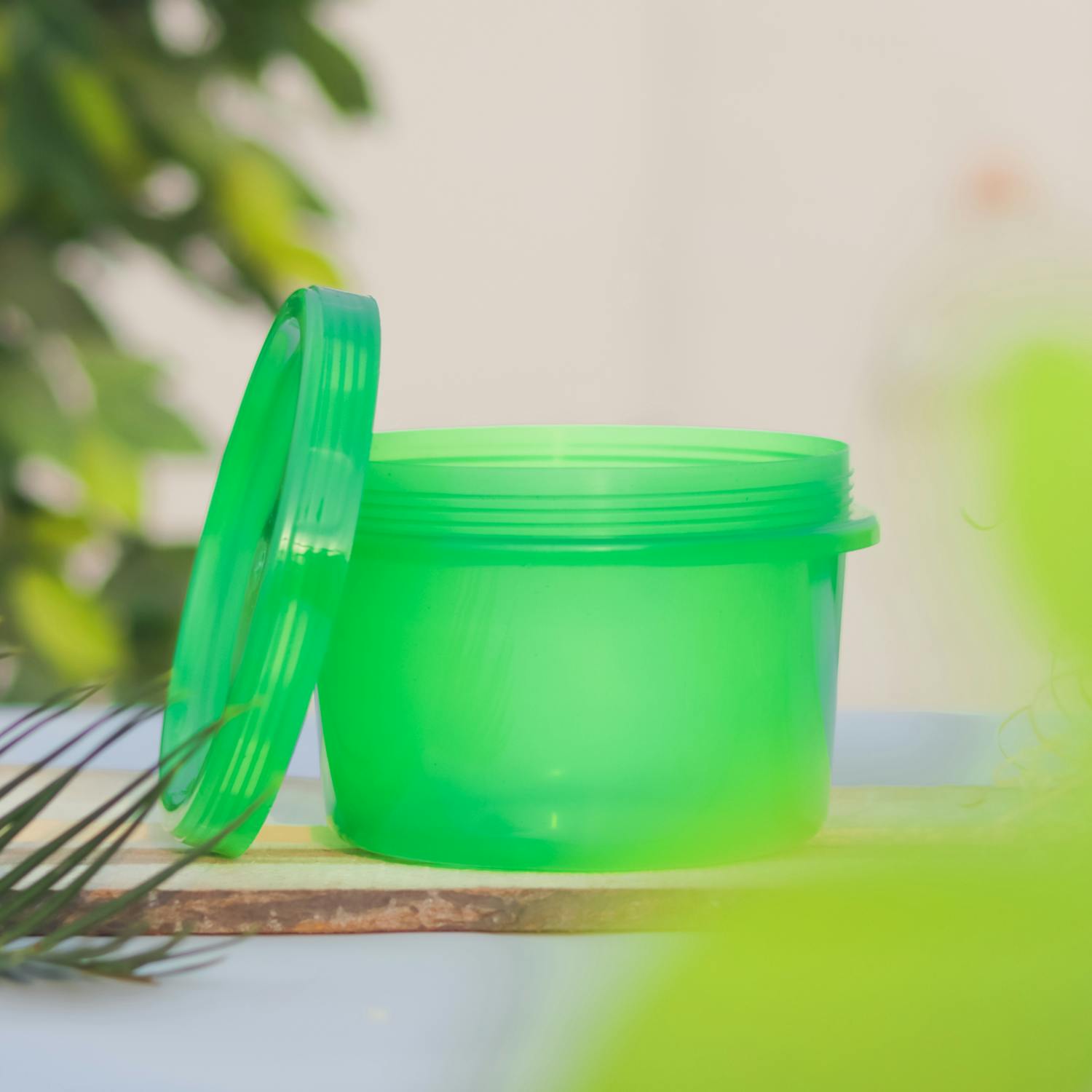 A Green Plastic Container with Lid, another toxic kitchen item