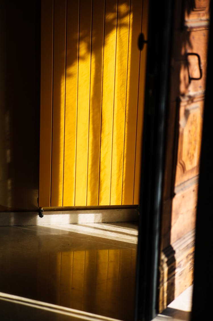 Sun Shining On Yellow Wooden Door 