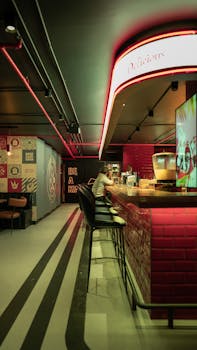 Contemporary bar setting in İstanbul with neon accents, captured at night.