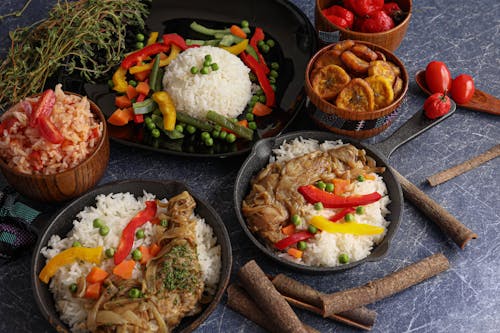 Rice Dishes Served with Meat and Vegetables in Iron Pots