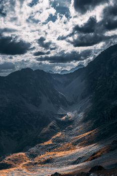 Brown and Black Mountains Under White Clouds