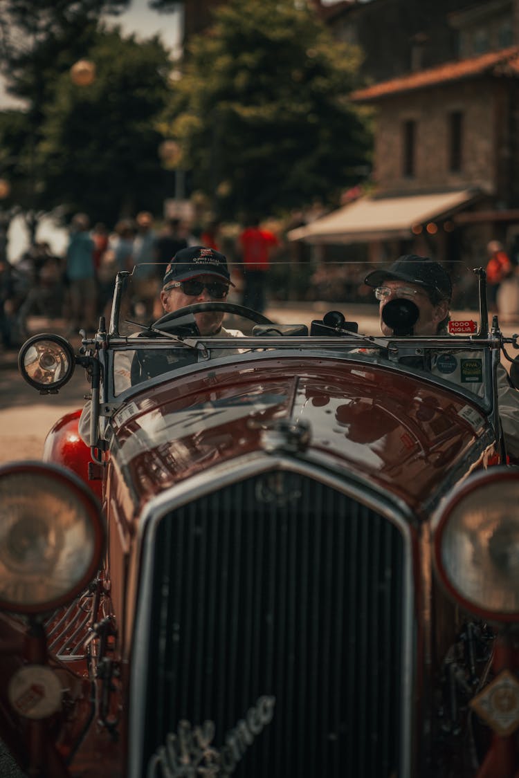 Men Riding In A Classic Car 