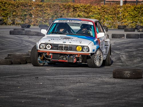 Free BMW motorsport vehicle speeding around a track with skillful handling in a race setting. Stock Photo