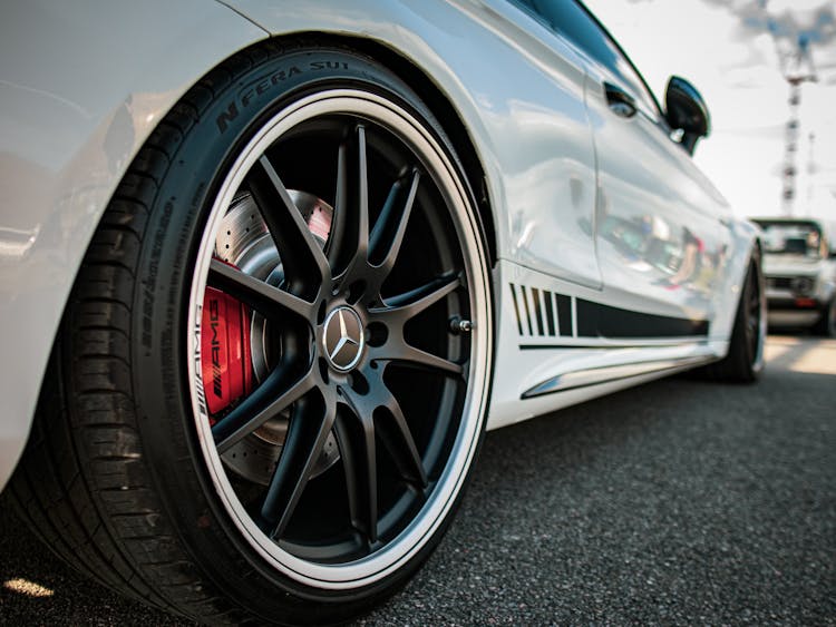 White Mercedes Benz Wheel Close-Up Photo