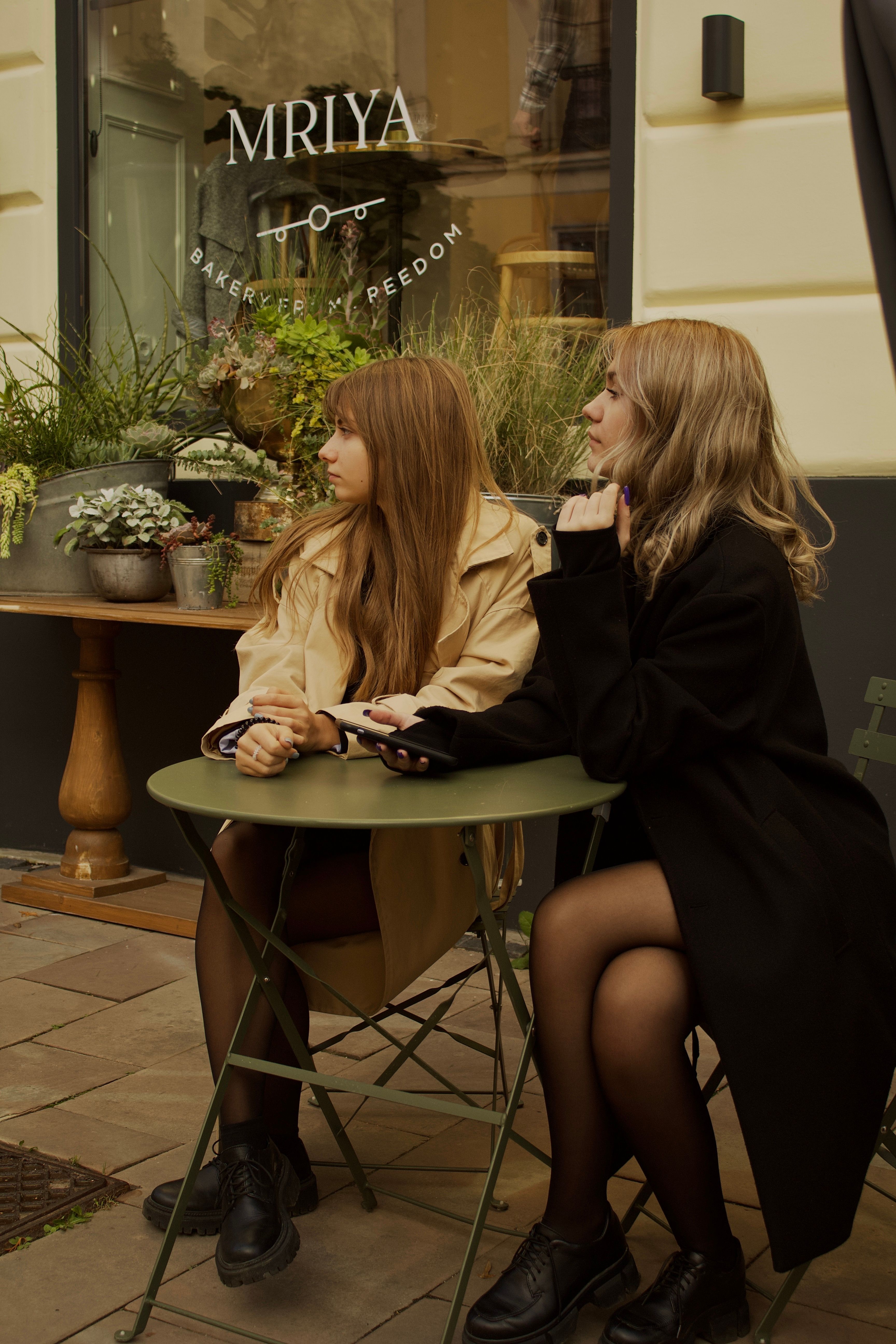 Young couple on a date using smartphones for communication