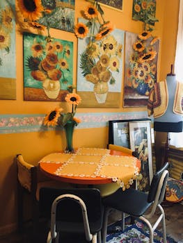 Charming indoor corner with sunflowers and vibrant art creating a warm and inviting dining space.
