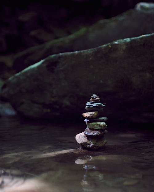 Stacked Rocks on Water Surface