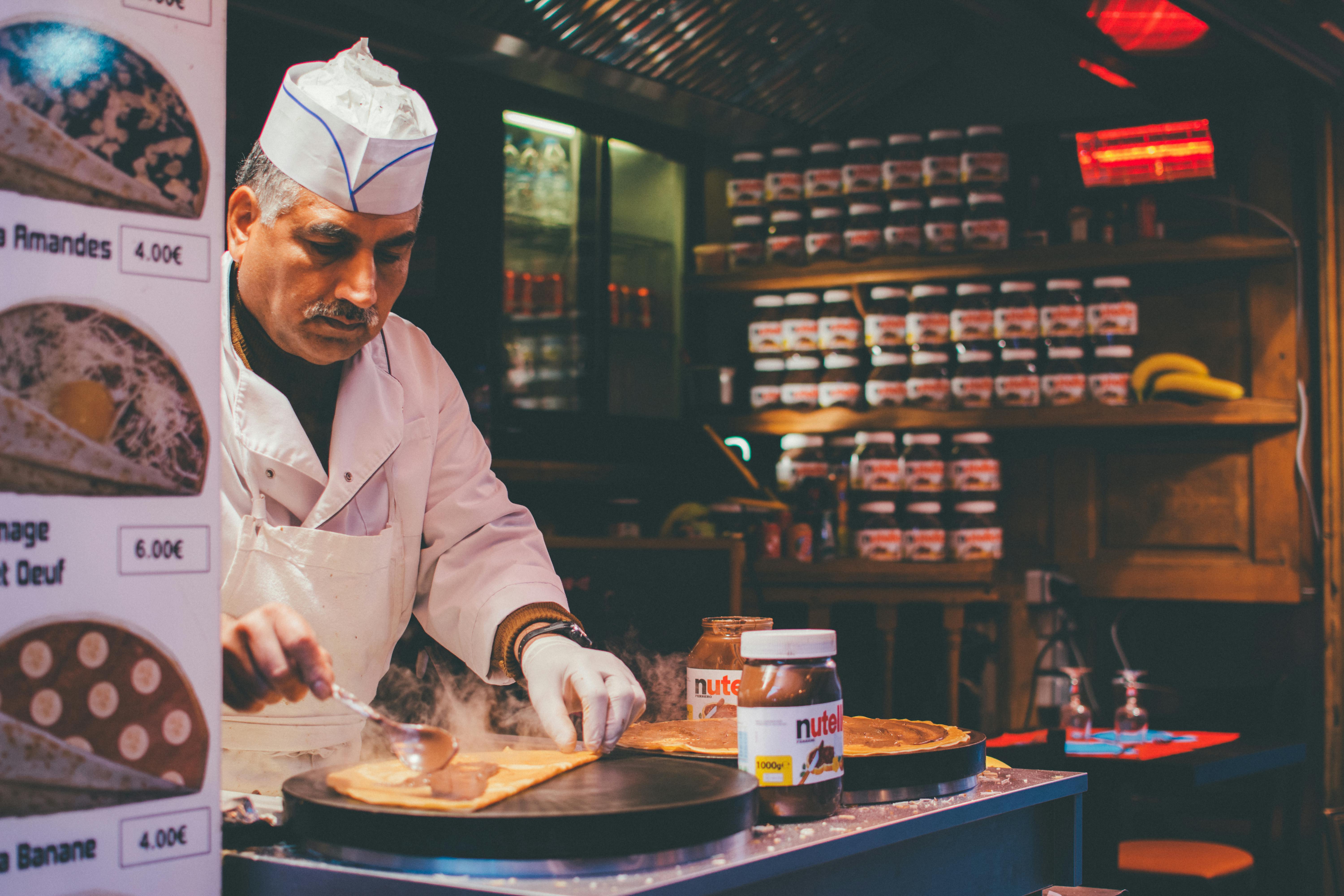 person cooking inside kitchen