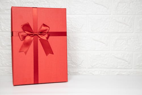 Free Red Box with a Red Ribbon Stock Photo