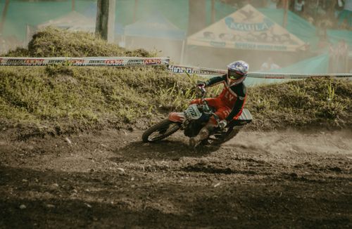 Free Thrilling motocross action shot capturing a rider on a dirt track. Stock Photo