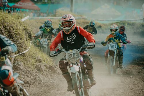 Free Thrilling motocross competition with racers in action on a dirt track. Stock Photo